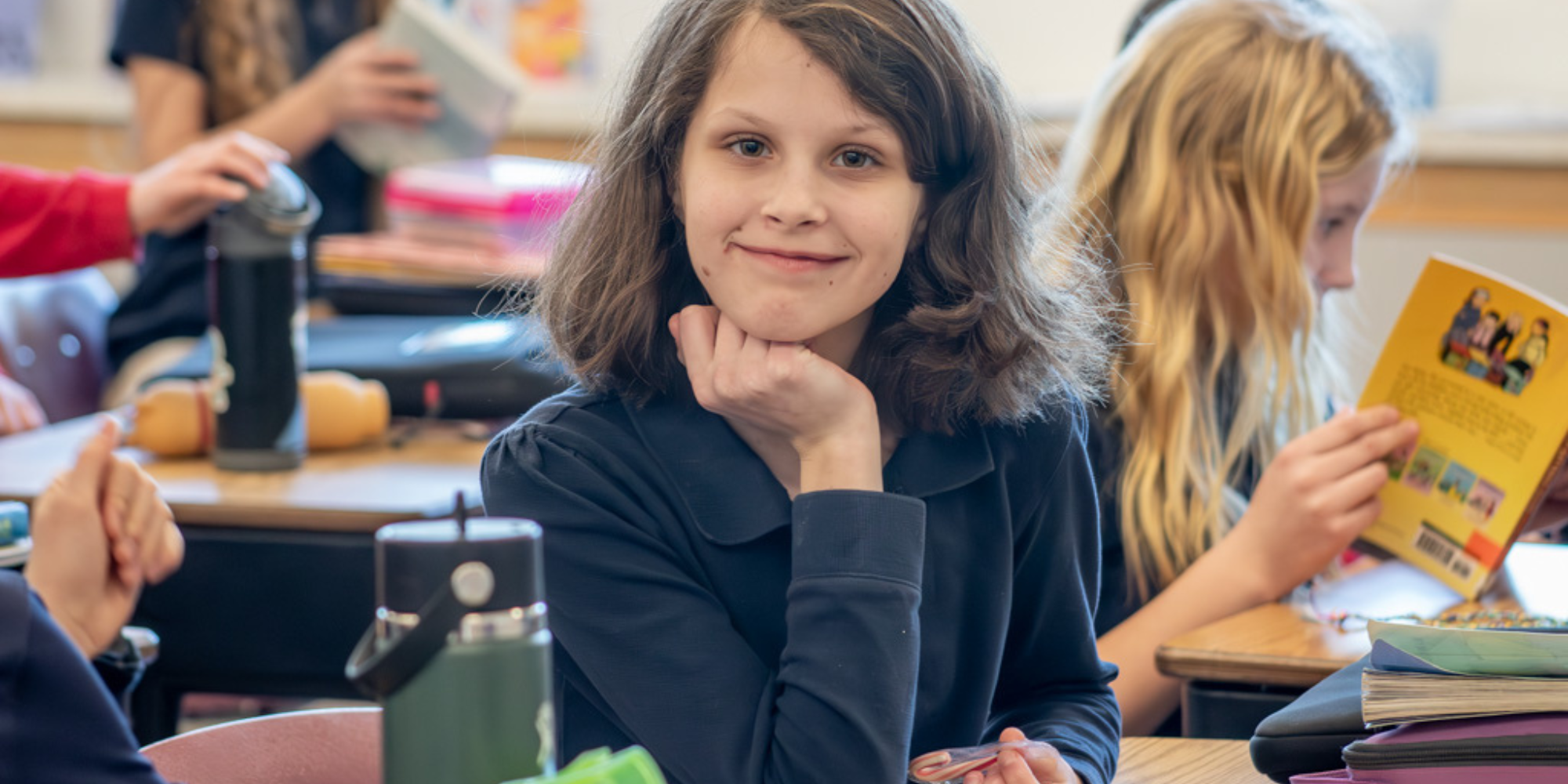 Our Lady of Lourdes Catholic School student at desk in classroom